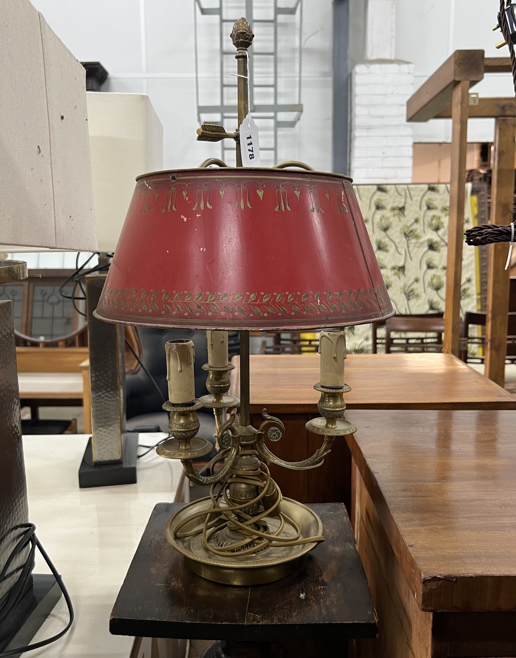 A gilt metal three branch table lamp with toleware shade, a mahogany pedestal and a wall bracket